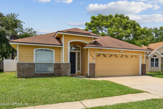 front view of a house with a yard