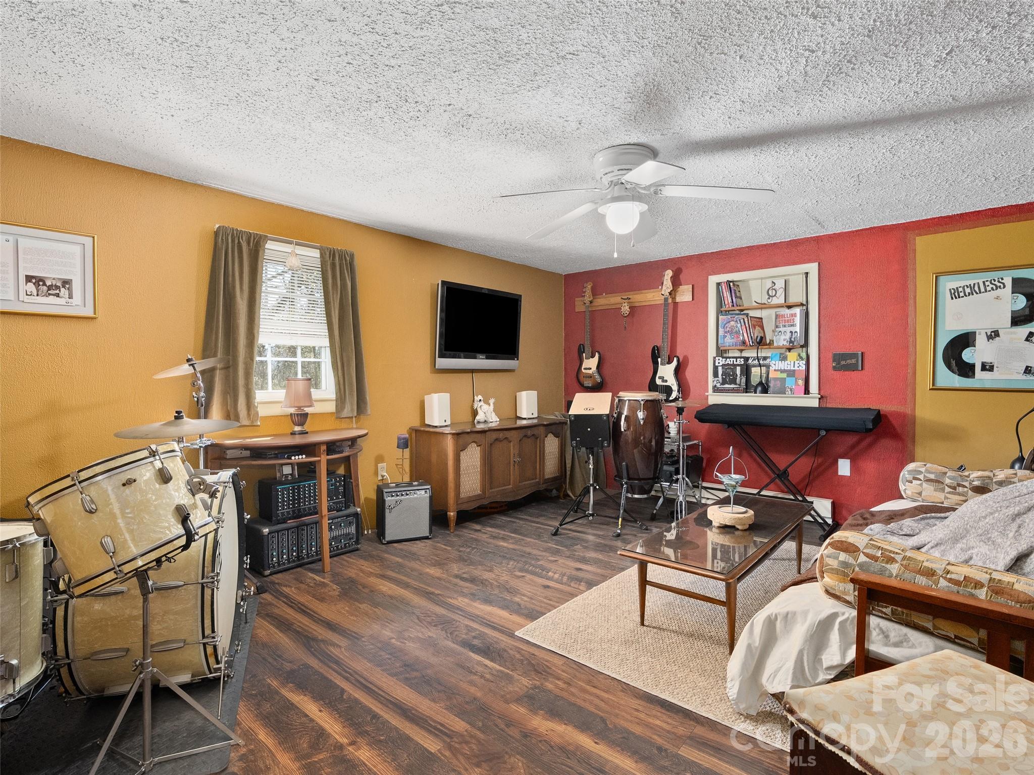 19 Mingus Street Canton, NC 28716 - Photo 16 of 28 a living room with furniture a flat screen tv and wooden floor