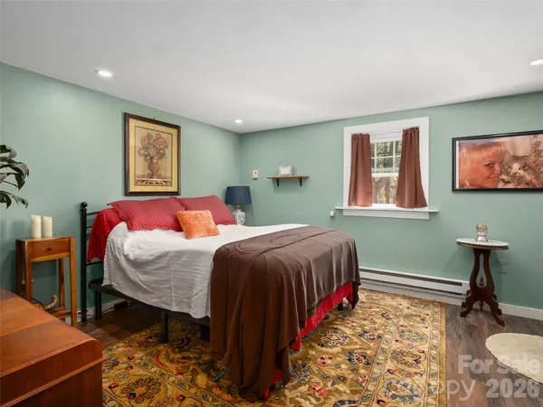a bedroom with double bed and a window