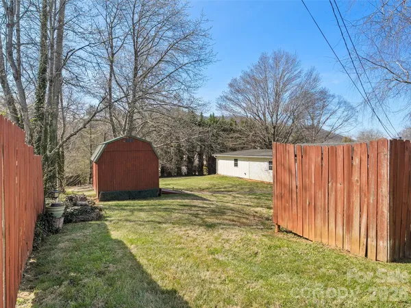 a view of a backyard of the house