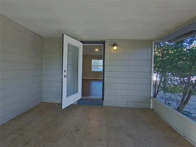 wooden floor and window in an empty room