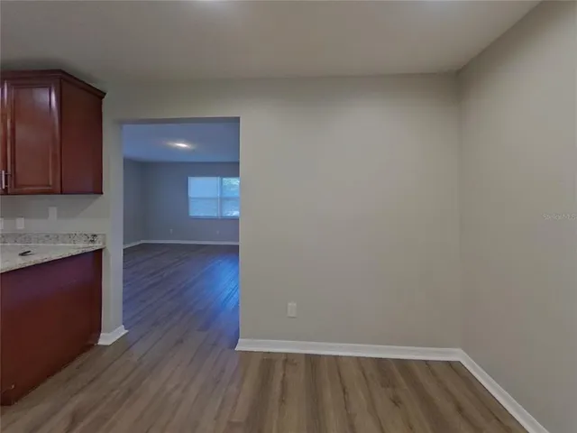 a view of kitchen and wooden floor