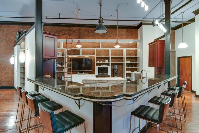 a kitchen with a sink and a large window
