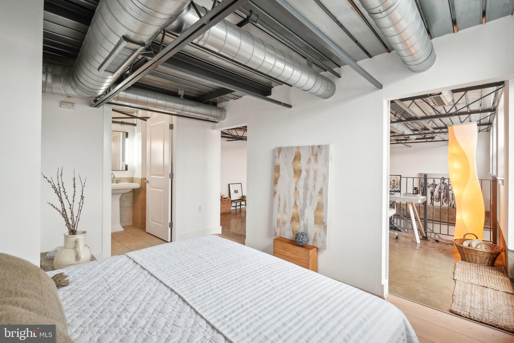 2301 Champlain Street Northwest, Unit 412 Washington, DC 20009 - Photo 13 of 20 a bedroom with a bed with the view of hallway