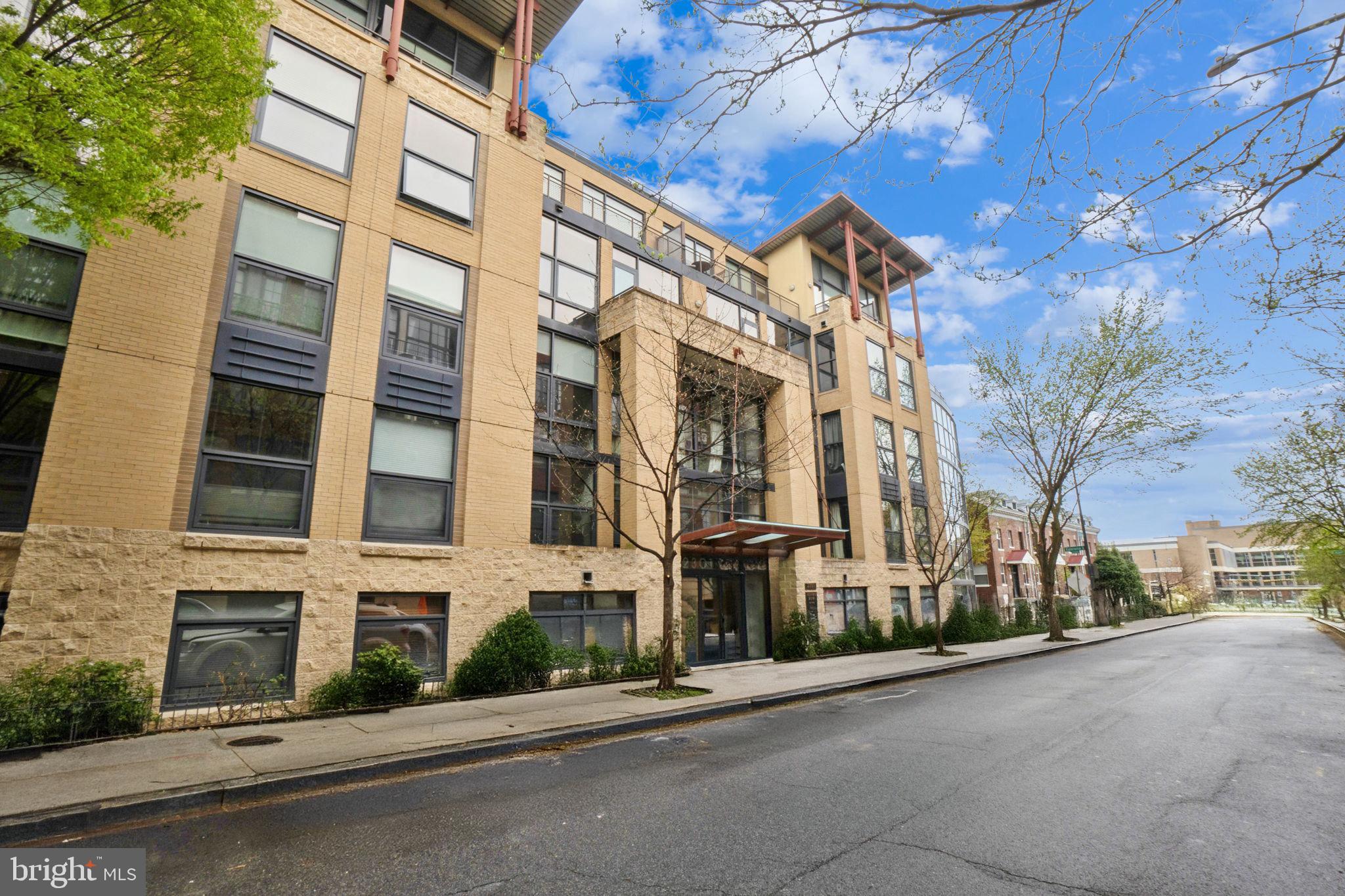 2301 Champlain Street Northwest, Unit 412 Washington, DC 20009 - Photo 2 of 20 a view of a street with a building in the background