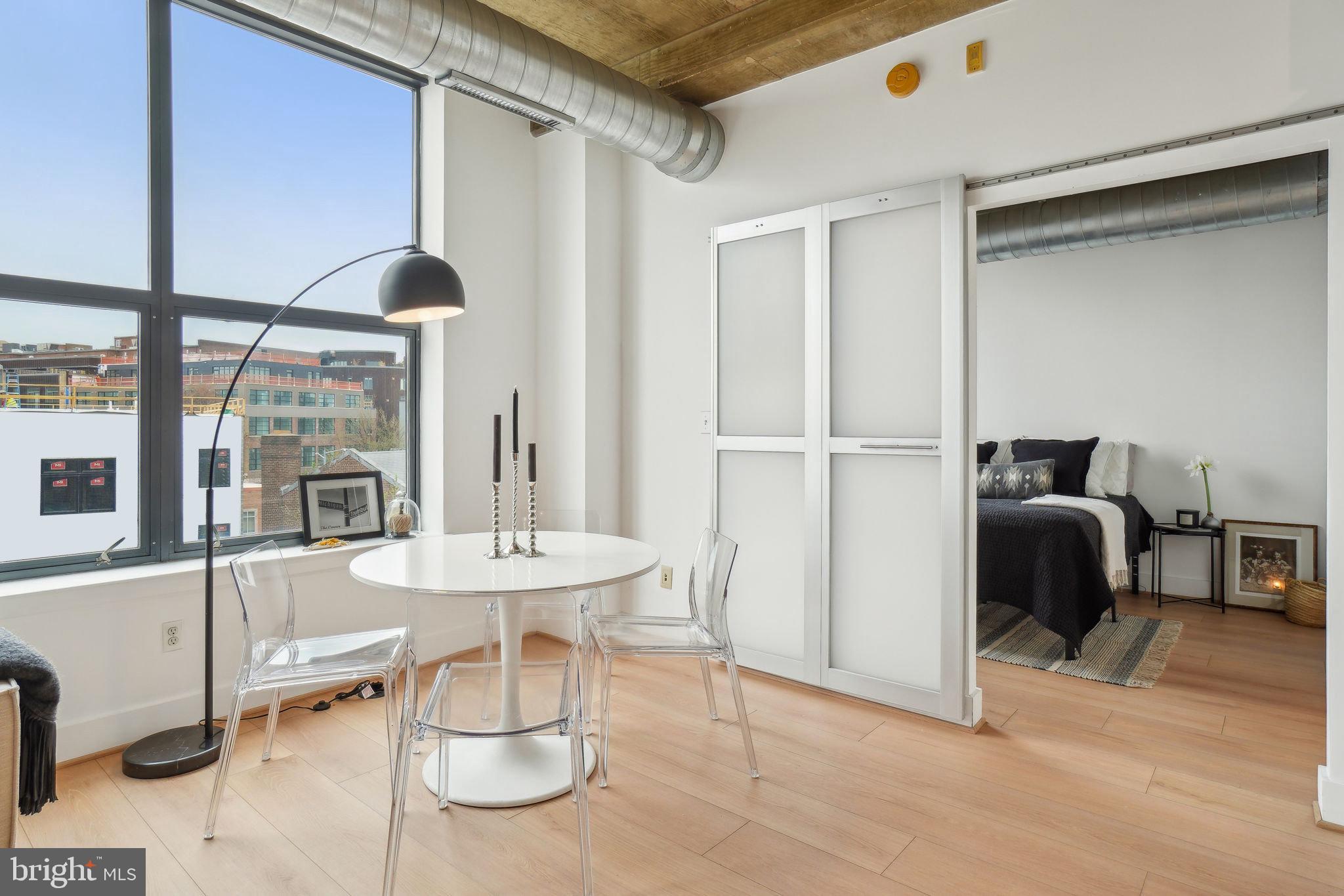 2301 Champlain Street Northwest, Unit 412 Washington, DC 20009 - Photo 5 of 20 a dining room with furniture and a window