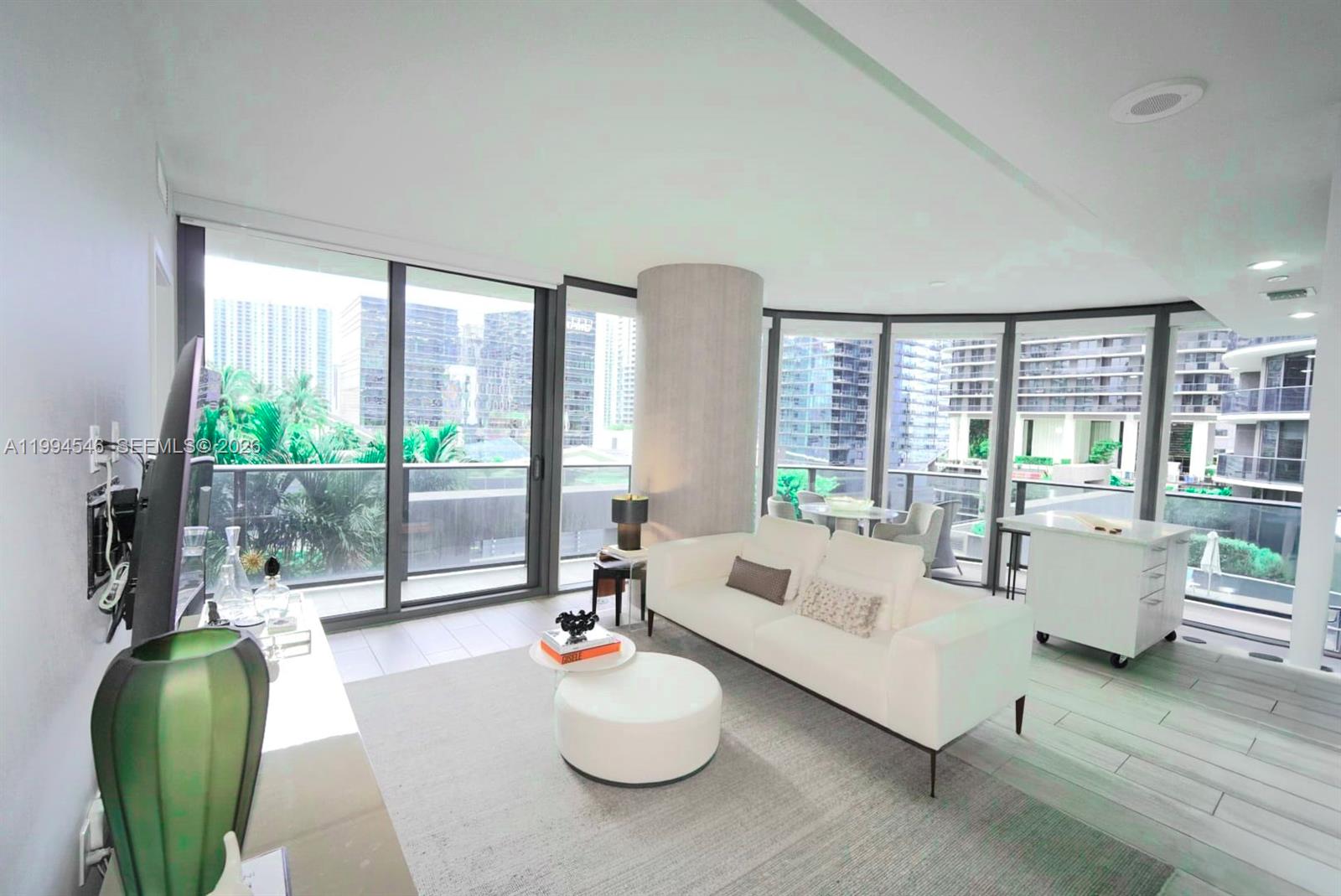55 Southwest 9th Street, Unit 1001 Miami, FL 33130 - Photo 11 of 30 a living room with furniture and a large window