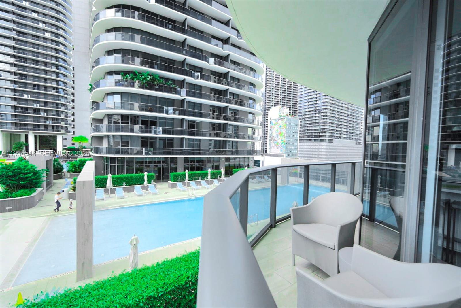 55 Southwest 9th Street, Unit 1001 Miami, FL 33130 - Photo 25 of 30 a view of balcony with two chairs and a table
