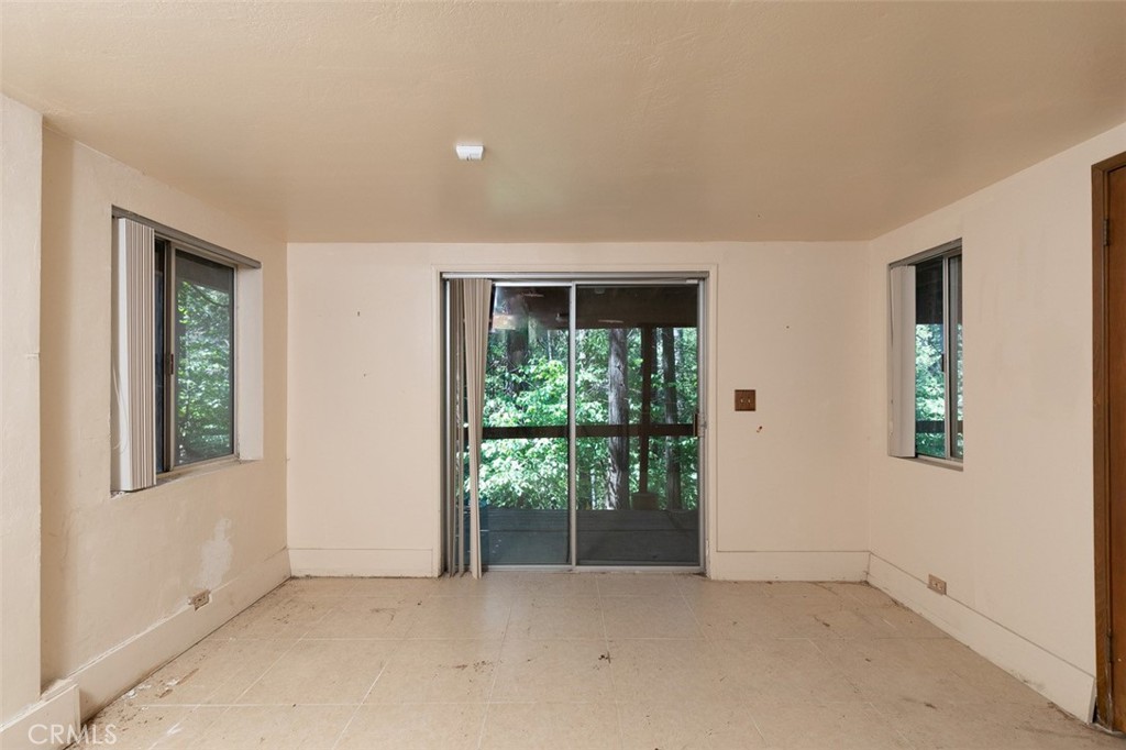 465 Blue Jay Canyon Road Blue Jay, CA 92317 - Photo 17 of 26 an empty room with windows