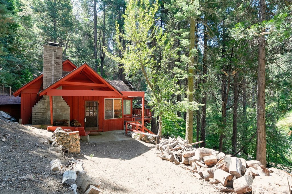 465 Blue Jay Canyon Road Blue Jay, CA 92317 - Photo 9 of 26 a backyard of a house with yard fire pit and outdoor seating