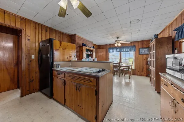 a kitchen with stainless steel appliances granite countertop a stove and refrigerator