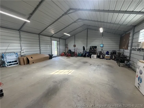 a big room with lots of furniture and a chandelier