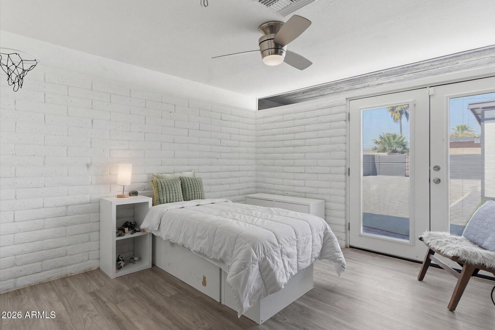 3020 East Wethersfield Road Phoenix, AZ 85032 - Photo 31 of 46 a bedroom with a bed and a table