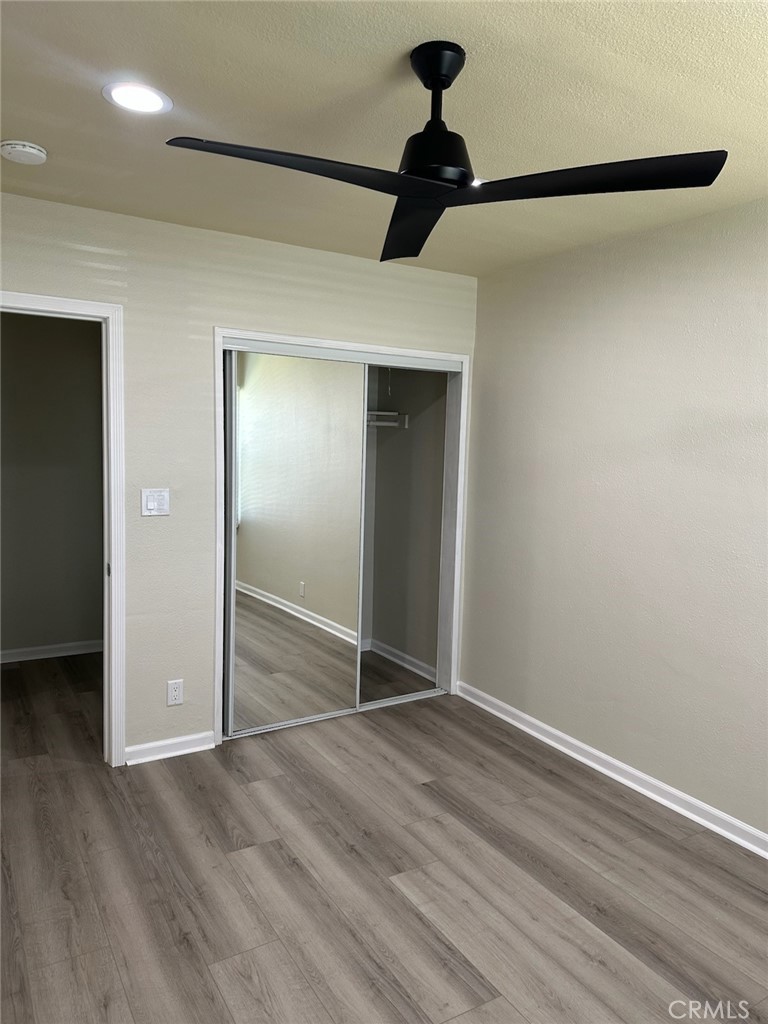 15702 Halldale Avenue Gardena, CA 90247 - Photo 12 of 25 a view of empty room with wooden floor