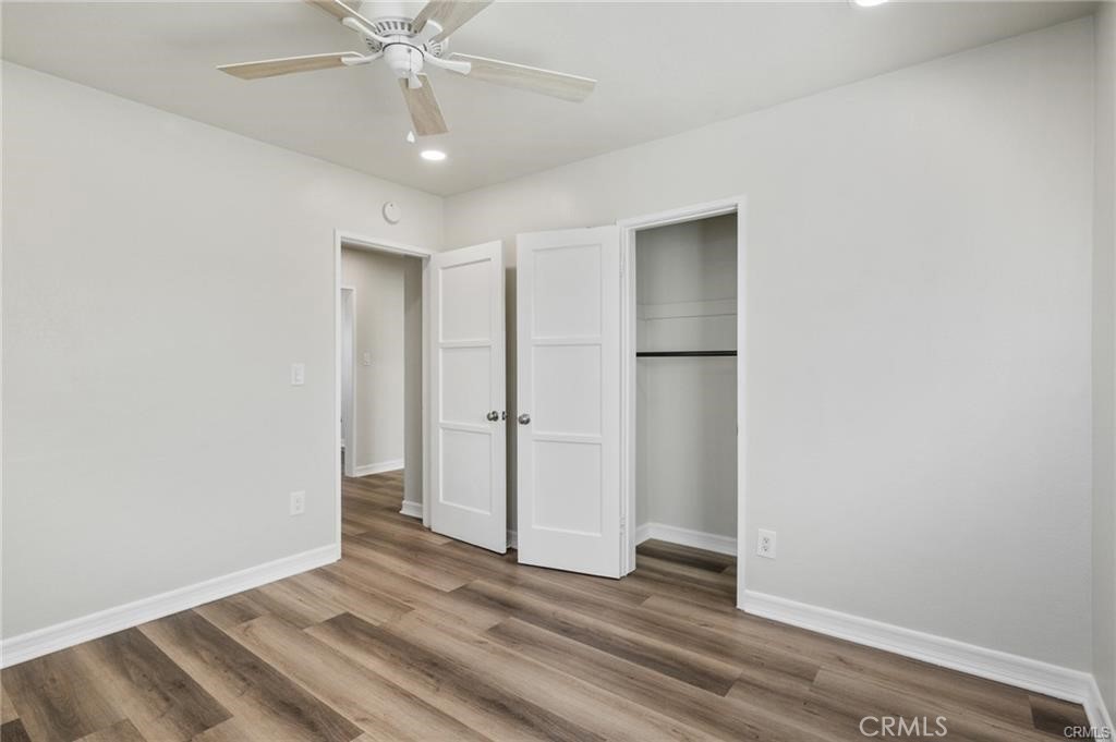 15702 Halldale Avenue Gardena, CA 90247 - Photo 16 of 25 a view of an empty room with wooden floor