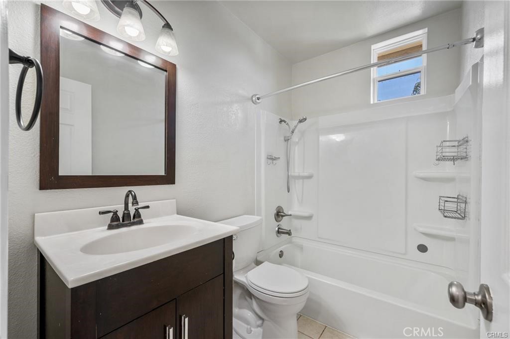 15702 Halldale Avenue Gardena, CA 90247 - Photo 18 of 25 a bathroom with a sink mirror toilet and bathtub