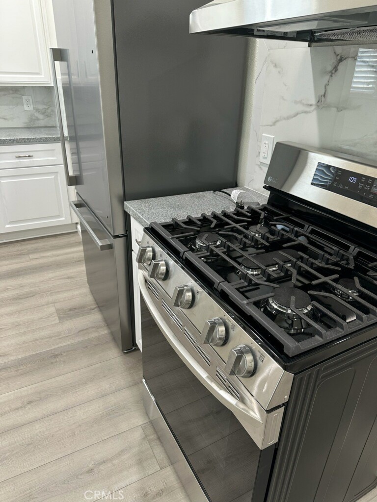 15702 Halldale Avenue Gardena, CA 90247 - Photo 4 of 25 a close view of a stove top oven