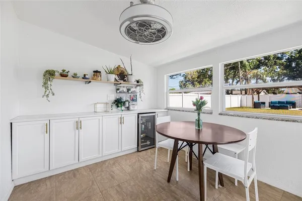 a view of a dining room with furniture window and outside view