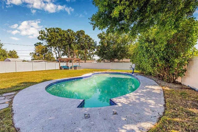 a view of a swimming pool with an outdoor space