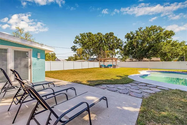 swimming pool with outdoor seating