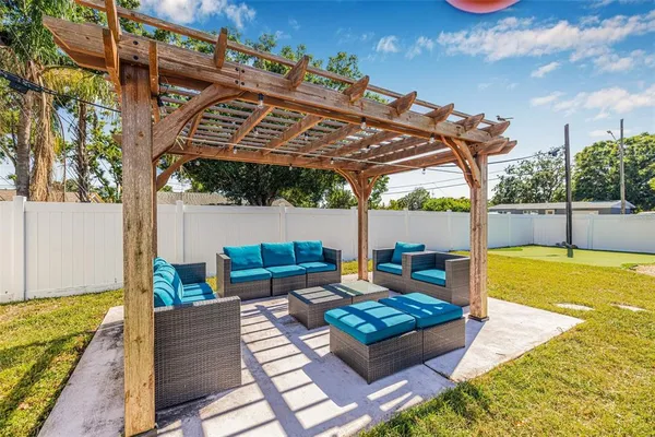 swimming pool view with a seating space