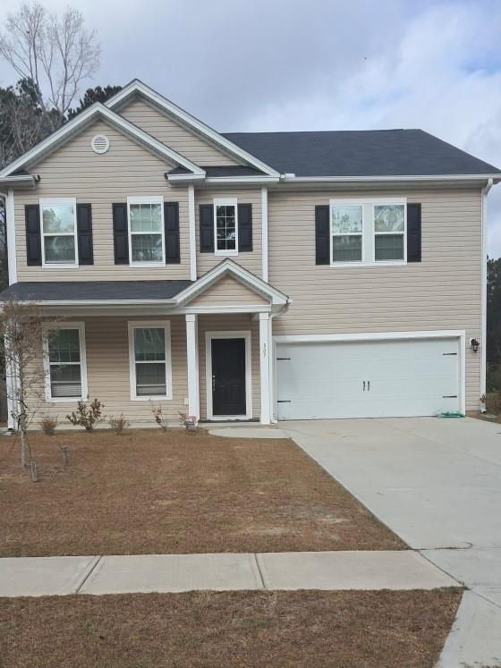 307 Serengeti Boulevard Pooler, GA 31322 - Photo 1 of 1 a front view of a house with yard