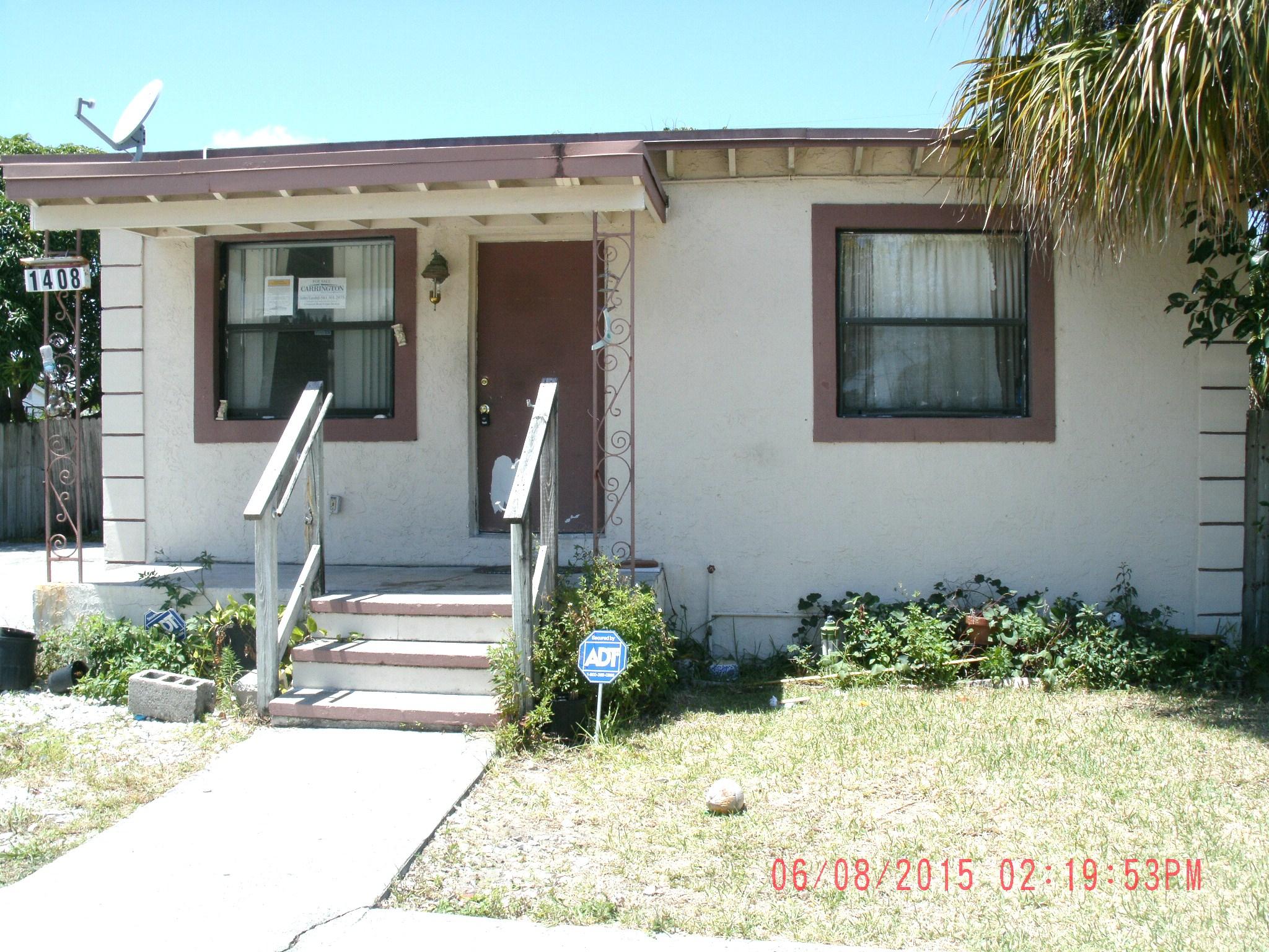 1408 West 29th Street Riviera Beach, FL 33404 - Photo 1 of 14 Front