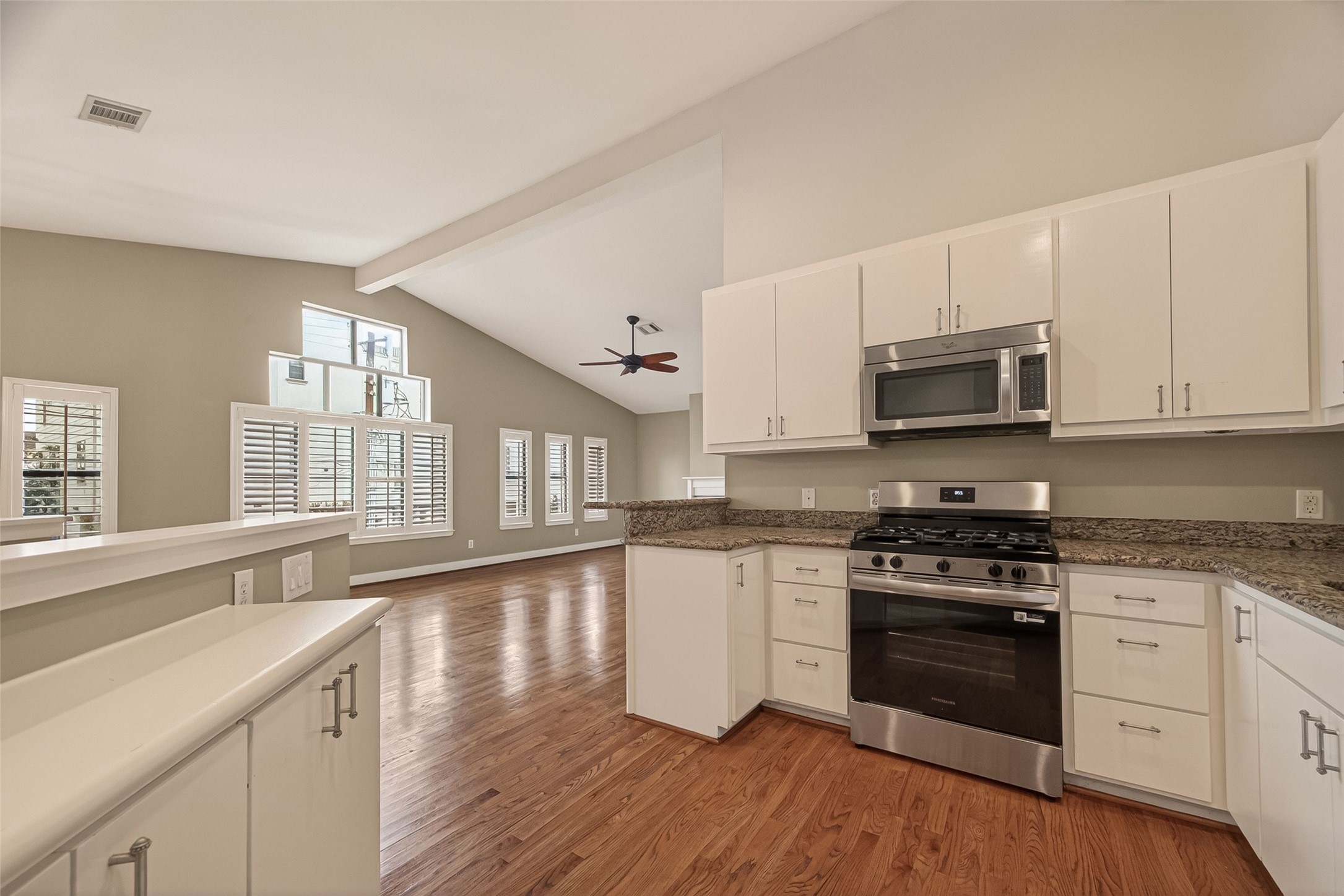 5665 Larkin Street Houston, TX 77007 - Photo 17 of 36 Open kitchen off the family room with an abundance of natural light through window plantation shutters.