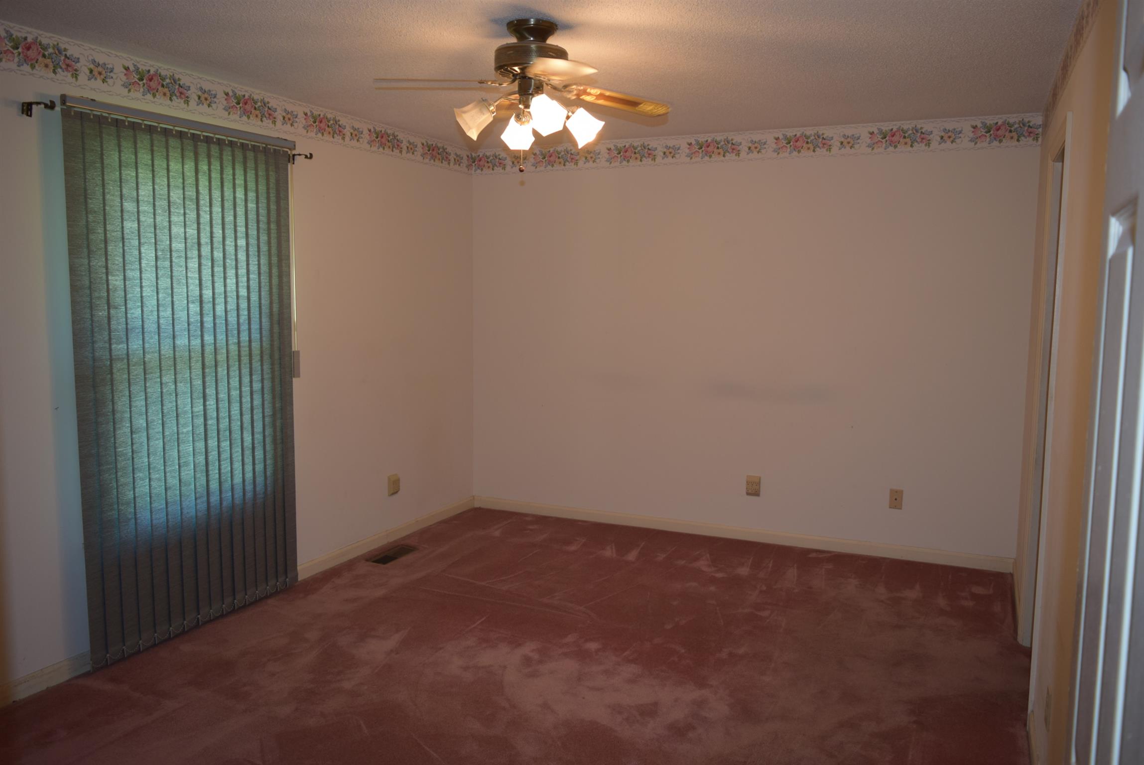 121 Asbury Road Manchester, TN 37355 - Photo 7 of 13 a view of empty room with window