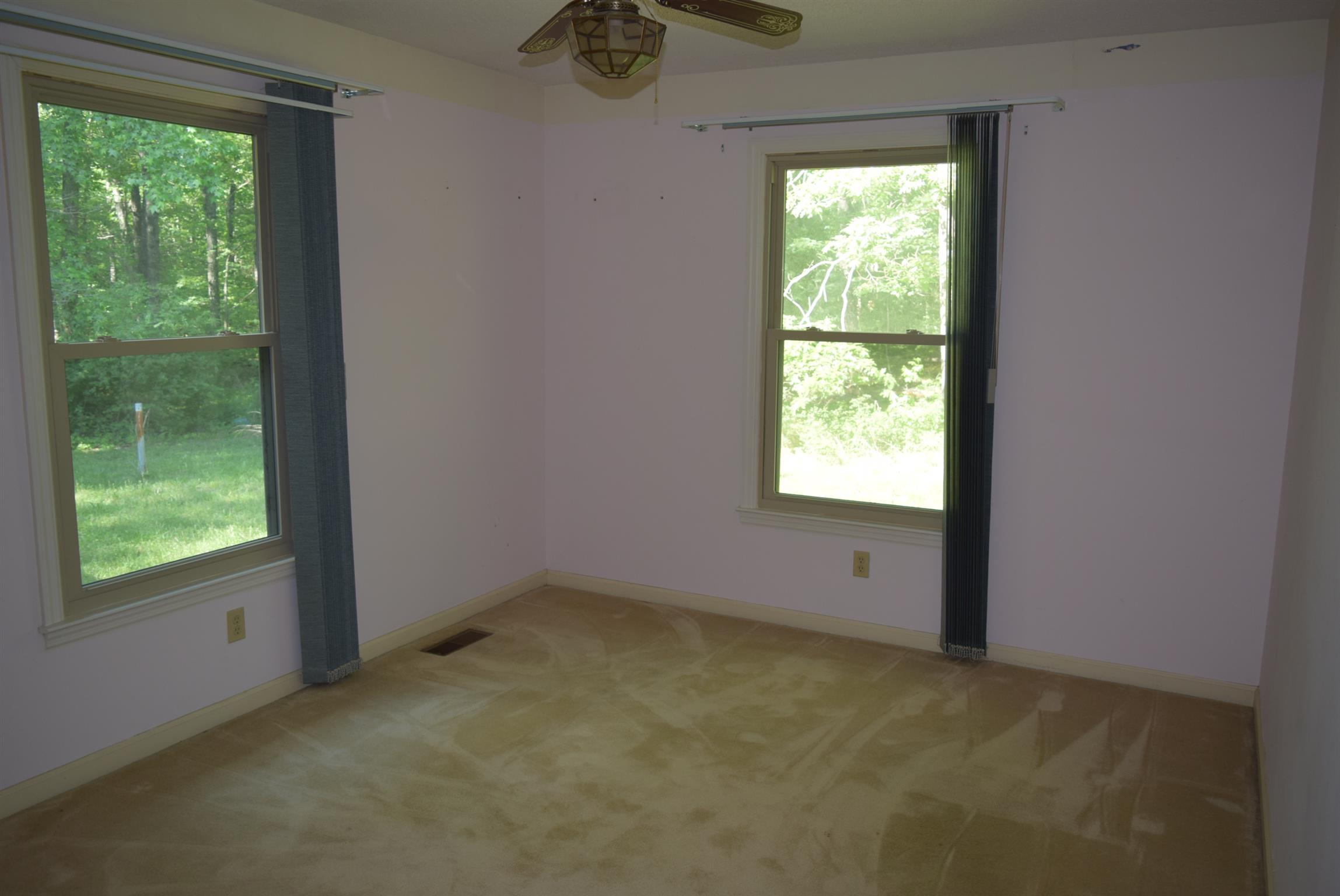 121 Asbury Road Manchester, TN 37355 - Photo 8 of 13 a view of an empty room with a window