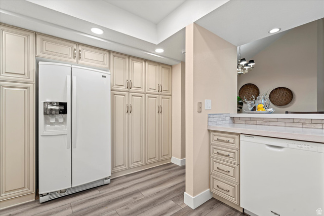888 East 6895 South Midvale, UT 84047 - Photo 12 of 54 Extensive cabinetry and built-in storage provide excellent organization, along with a full-size refrigerator and additional prep space.