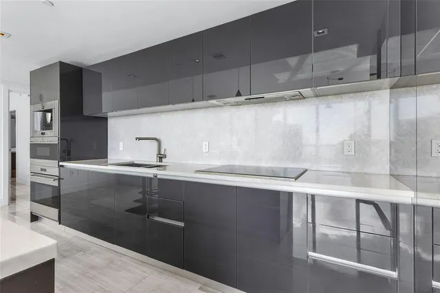 a large white bed in a white room