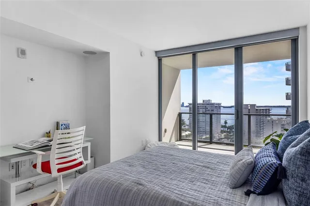 a bedroom with a bed and cabinets