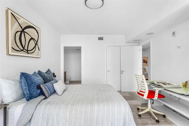 a bathroom with a sink toilet and mirror