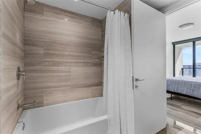 a large white bed in a white room