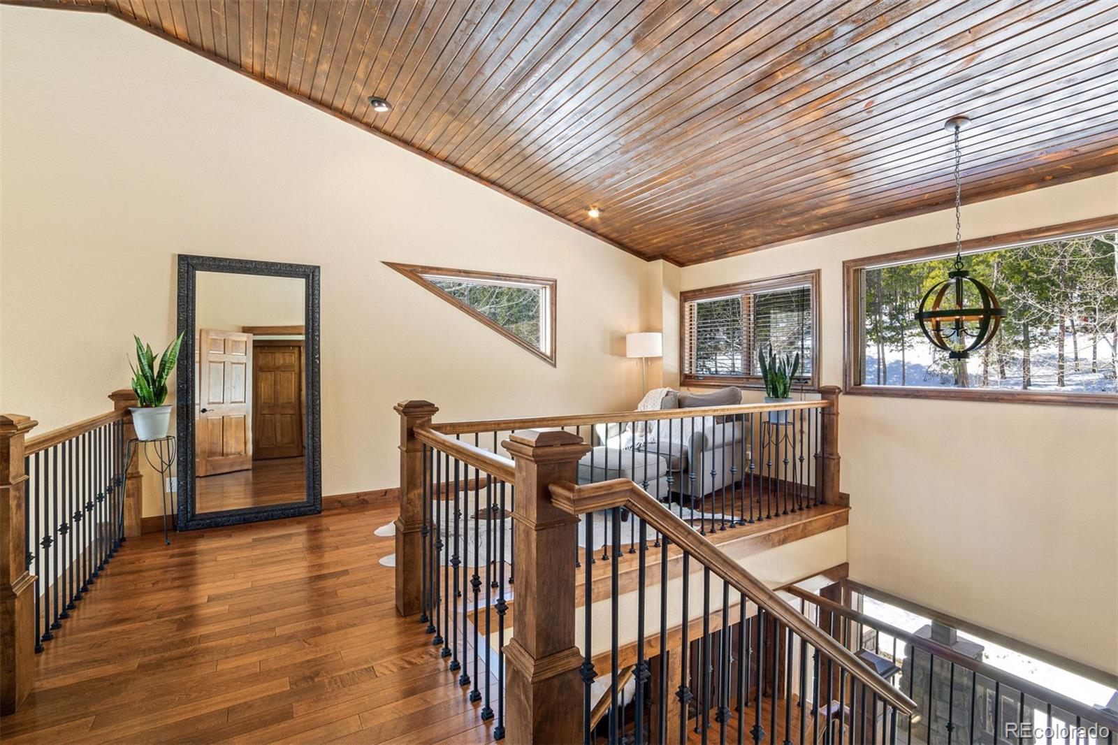 8331 South Warhawk Road Conifer, CO 80433 - Photo 22 of 40 a view of a balcony with furniture
