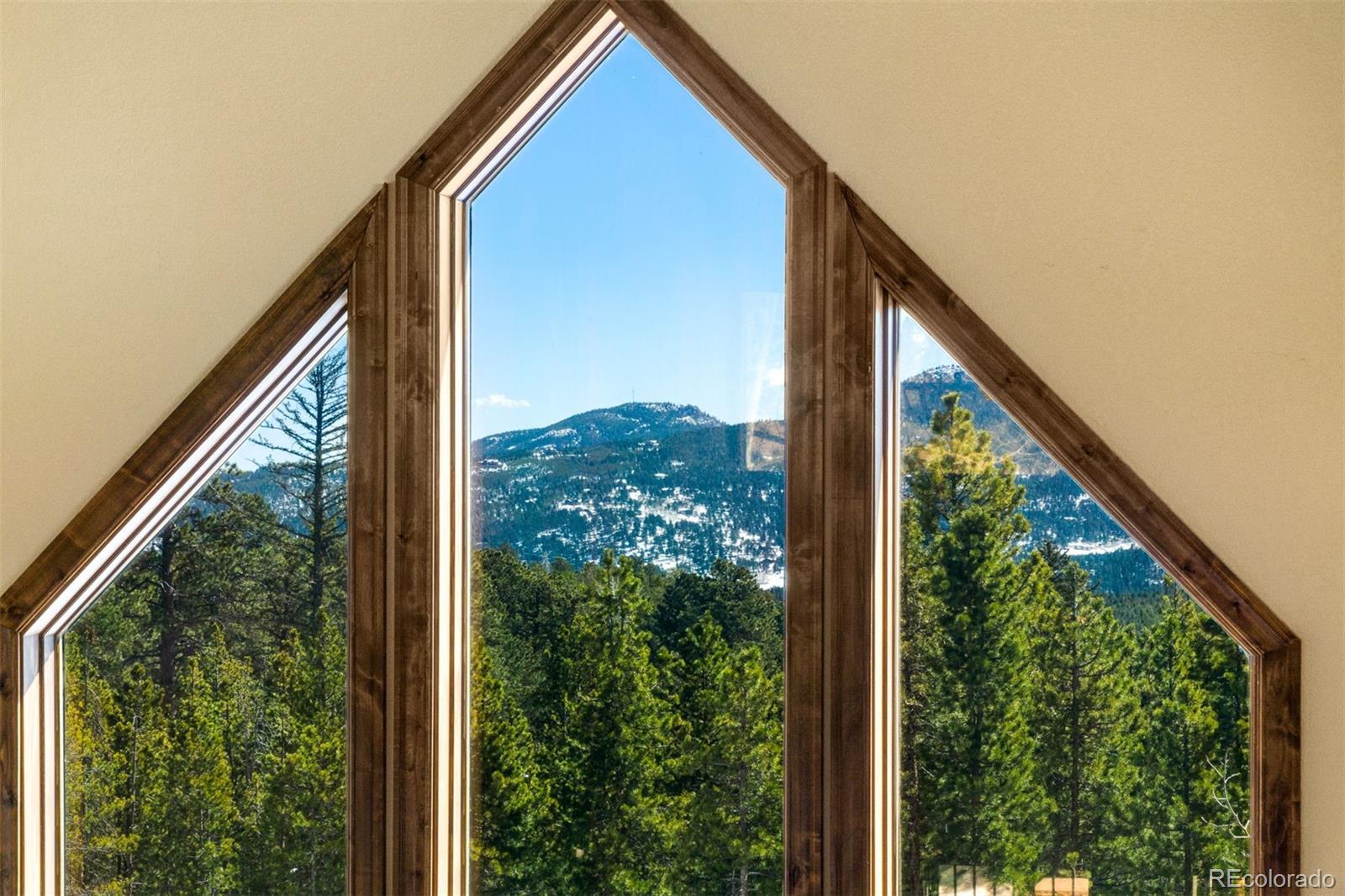8331 South Warhawk Road Conifer, CO 80433 - Photo 23 of 40 a view of a balcony with an outdoor space