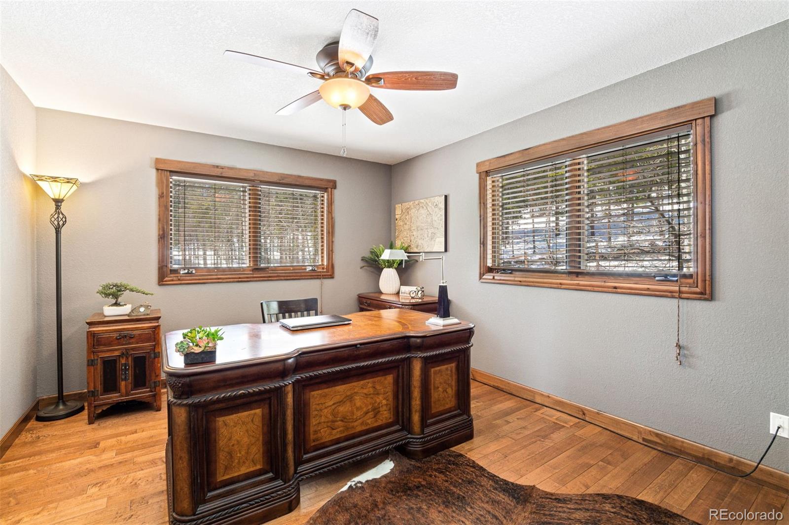 8331 South Warhawk Road Conifer, CO 80433 - Photo 25 of 40 a room with furniture and window