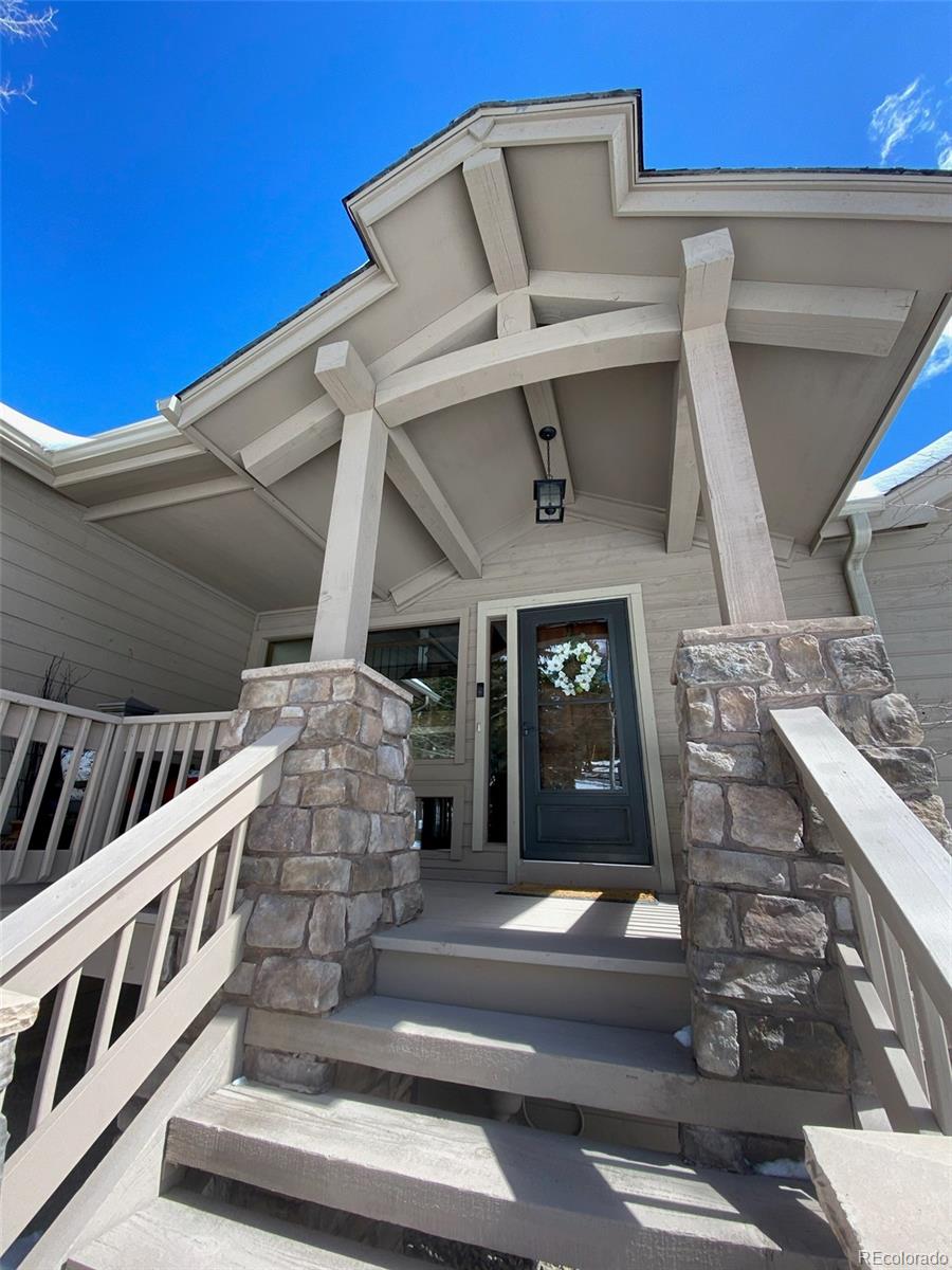 8331 South Warhawk Road Conifer, CO 80433 - Photo 3 of 40 a view of entryway with a front door