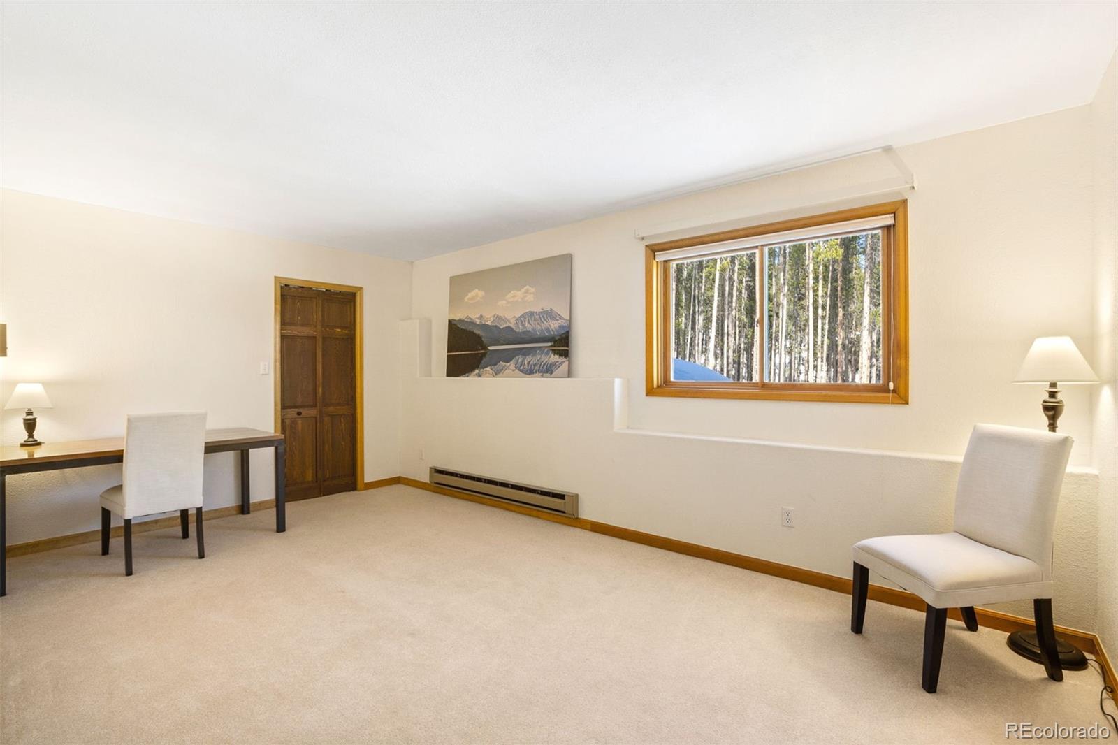 8331 South Warhawk Road Conifer, CO 80433 - Photo 31 of 40 a view of a livingroom with furniture and a window