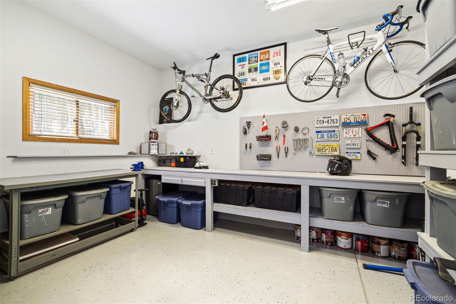 8331 South Warhawk Road Conifer, CO 80433 - Photo 33 of 40 a kitchen with stainless steel appliances a stove and cabinets