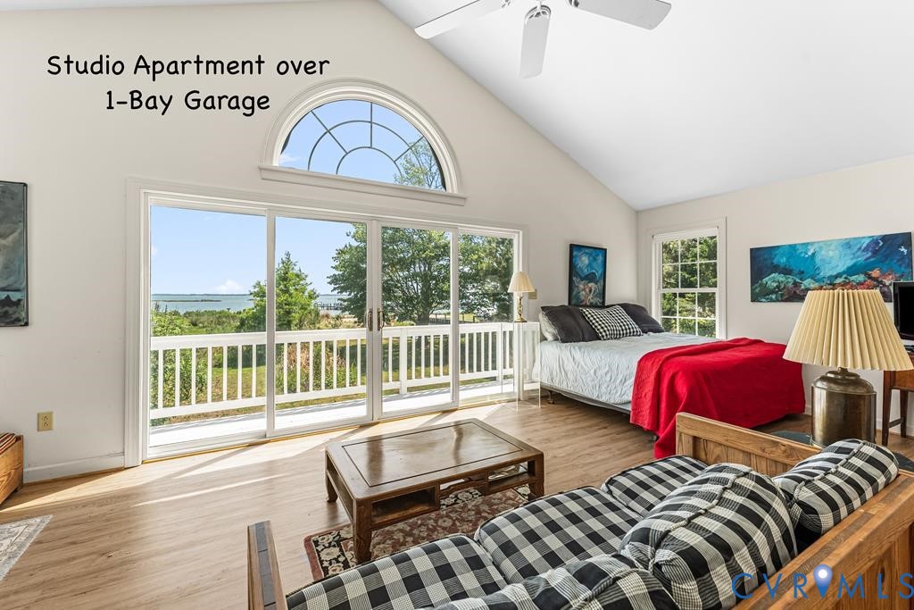 2414 Windmill Point Road White Stone, VA 22578 - Photo 52 of 72 a bedroom with two beds and a large window