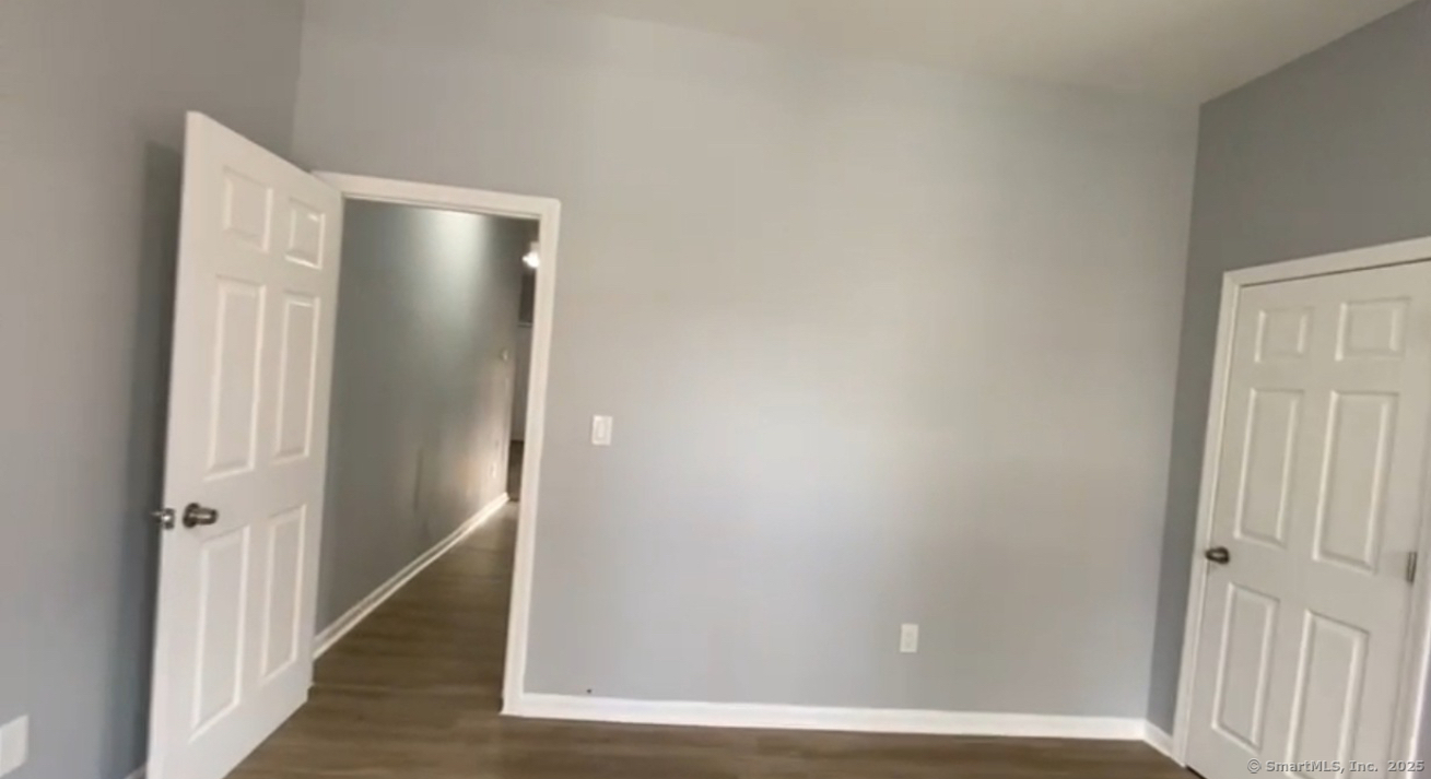 422 East Main Street, Unit 3F Bridgeport, CT 06608 - Photo 2 of 2 a view of a hallway with wooden floor