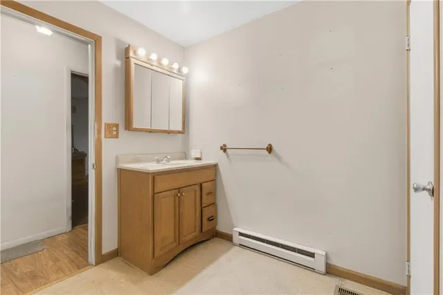 a bathroom with a sink a vanity and a mirror