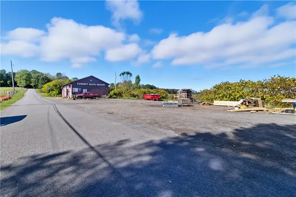 a view of a road with cars