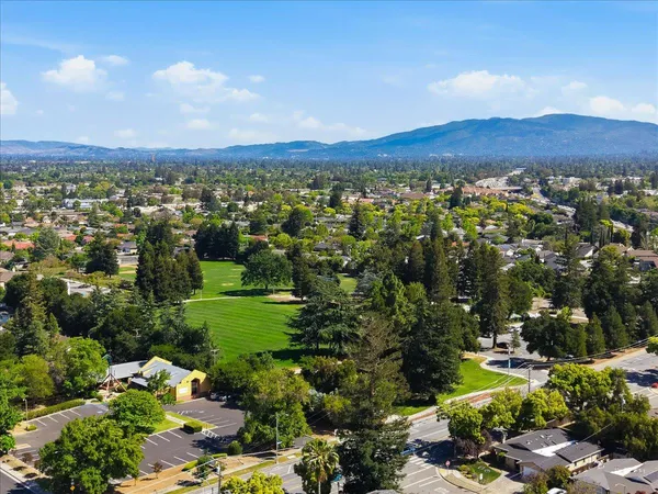 a view of a city with mountains in the background