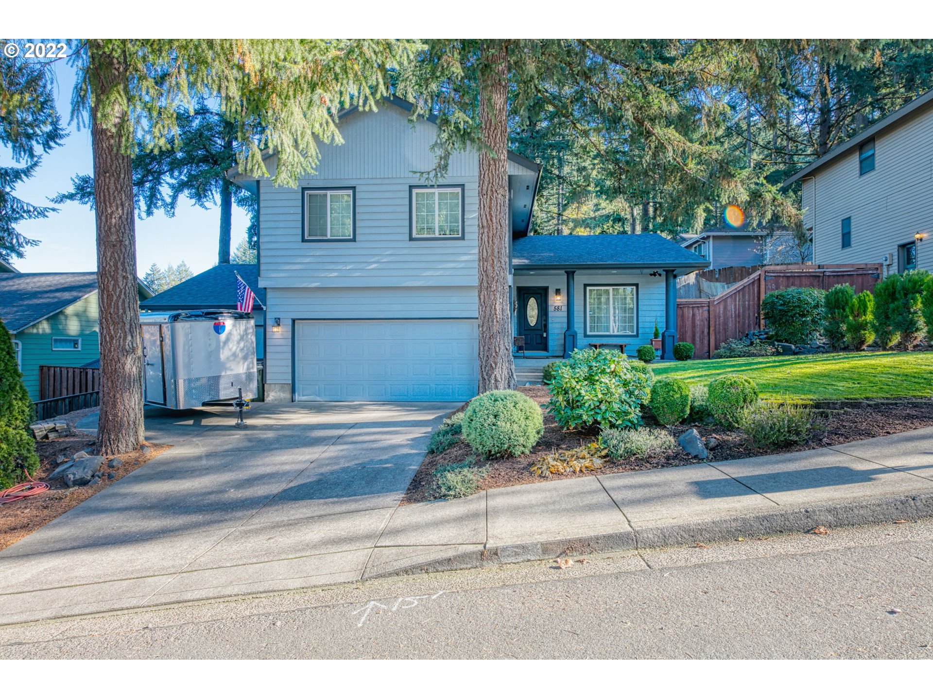 581 South 72nd Street Springfield, OR 97478 - Photo 1 of 25 a front view of a house with a yard and garage