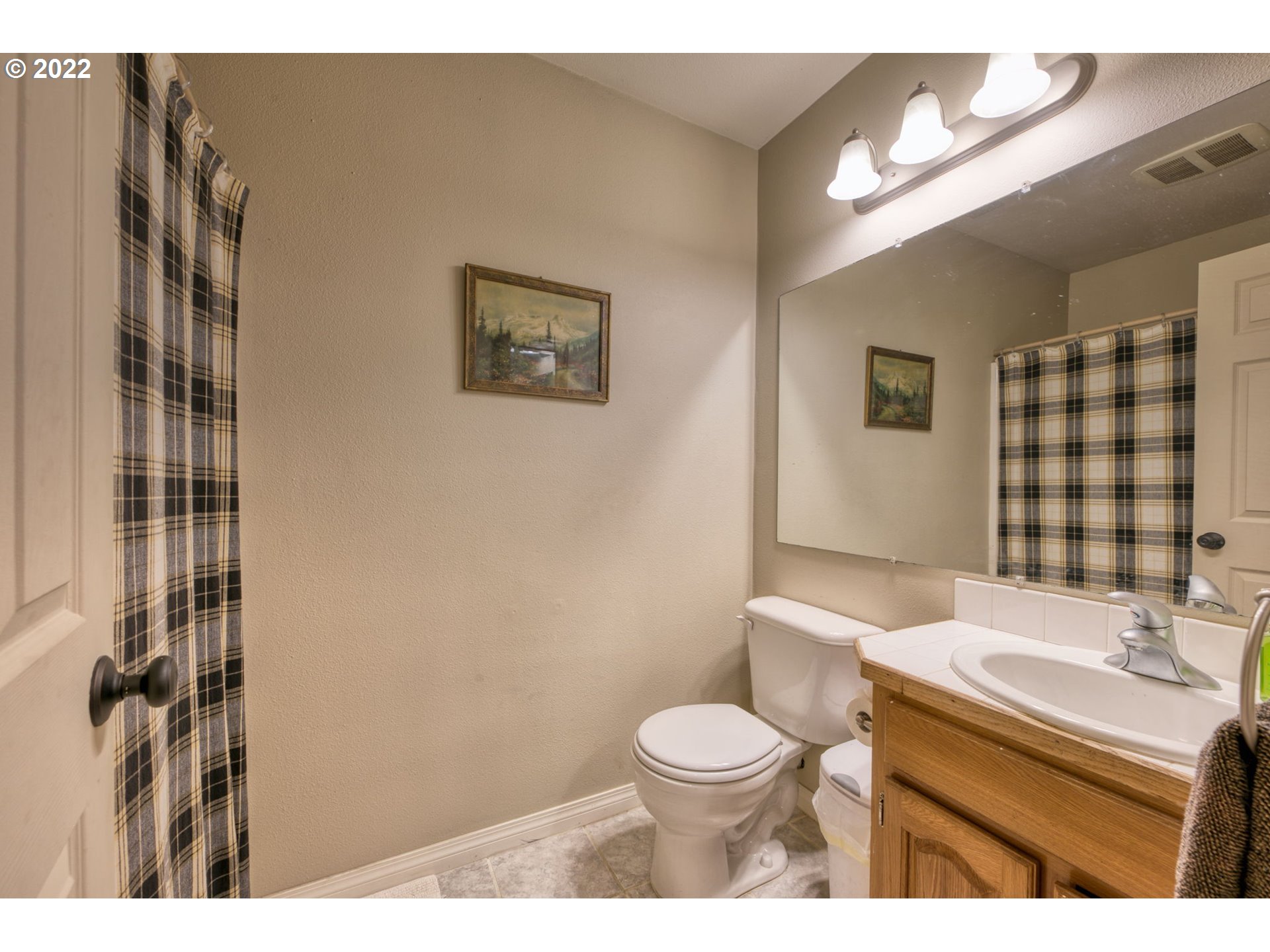 581 South 72nd Street Springfield, OR 97478 - Photo 20 of 25 a bathroom with a sink a toilet and shower