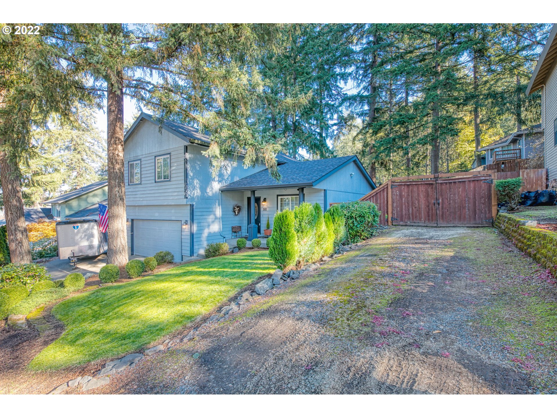 581 South 72nd Street Springfield, OR 97478 - Photo 4 of 25 a front view of a house with a yard and garage