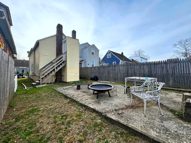 a view of a patio with two chairs and a table